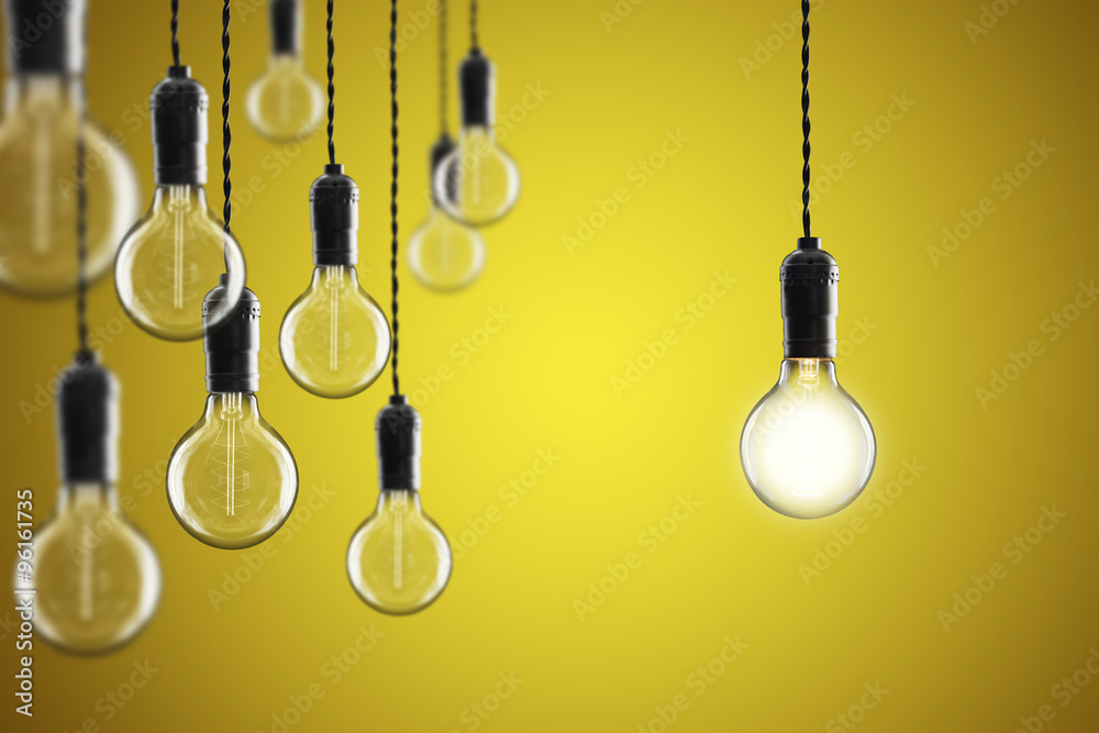 Idea and leadership concept Vintage incandescent Edison bulbs on