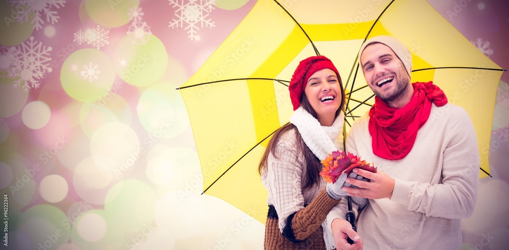 Composite image of autumn couple holding umbrella