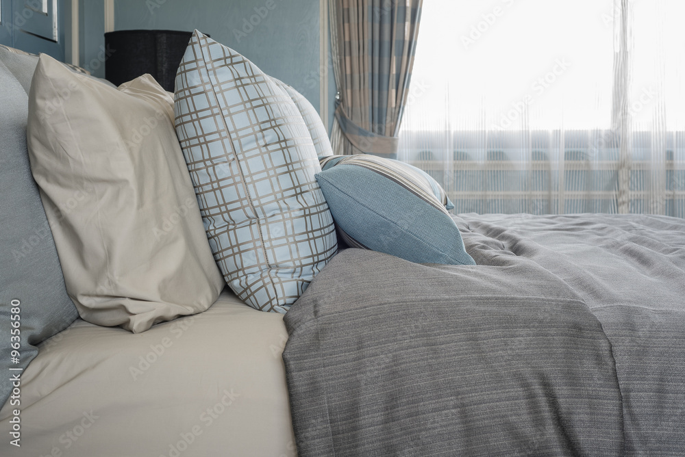 classic bedroom style with row of pillows