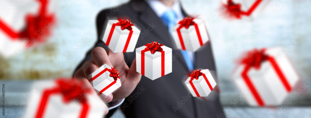 Man celebrating christmas holding gift in his hand