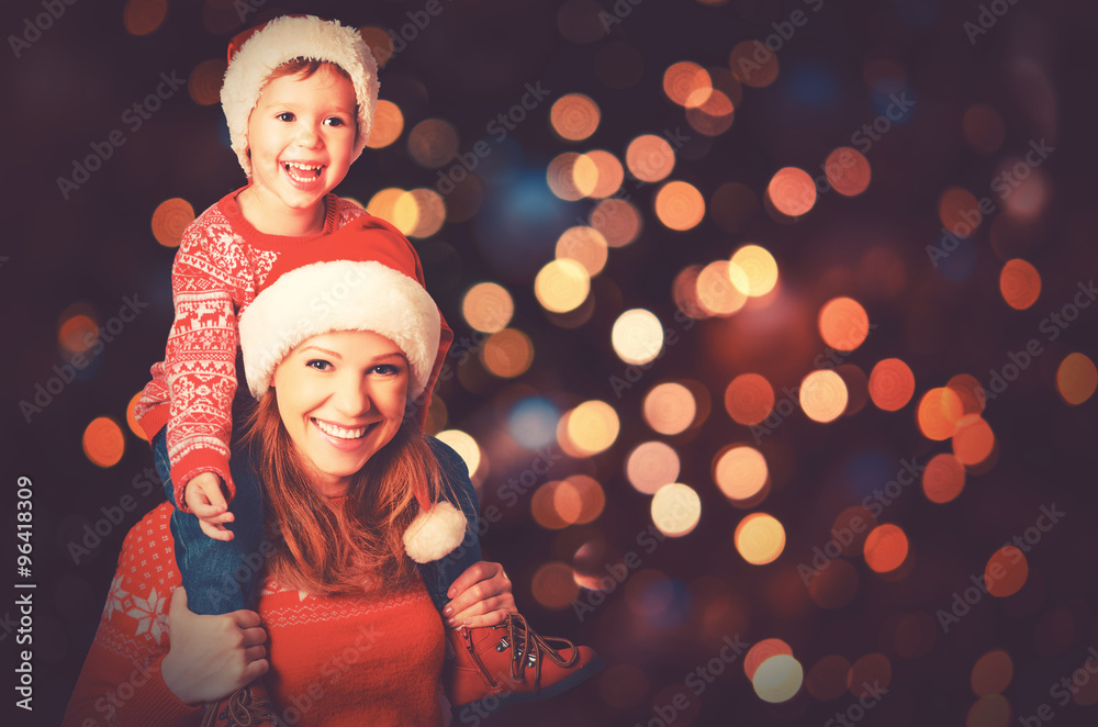 happy family mother and little child playing in Christmas