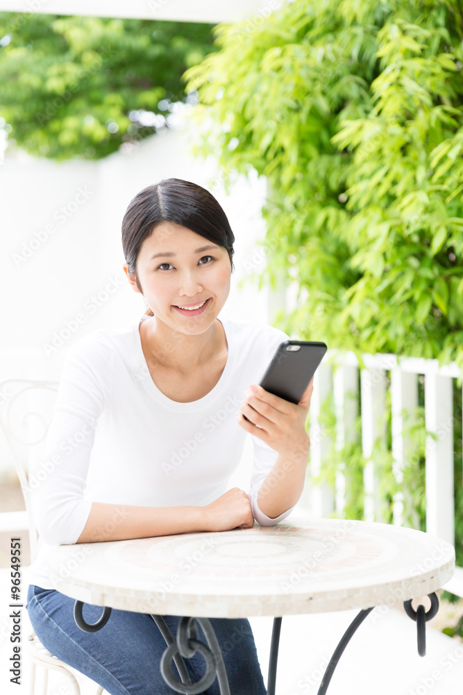 young asian woman using smart phone