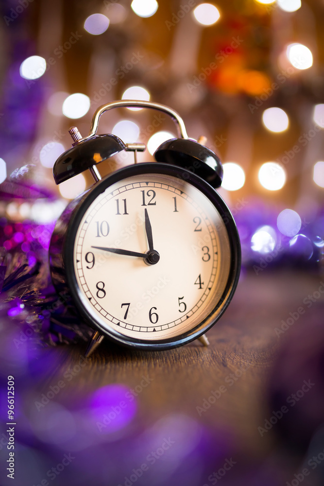 Vintage clock with Christmas decorations and lights