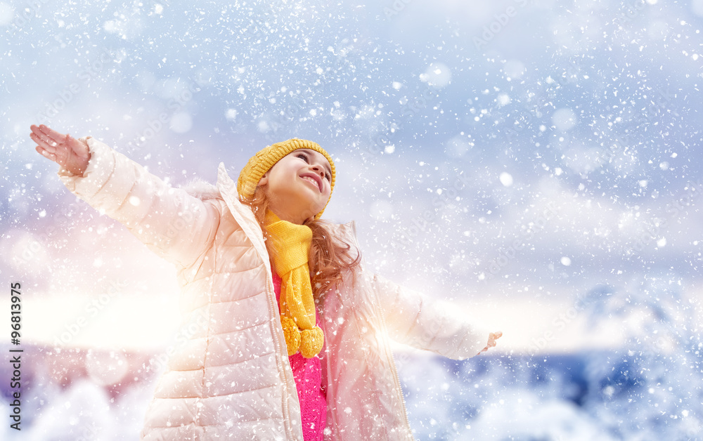 girl playing on a winter walk