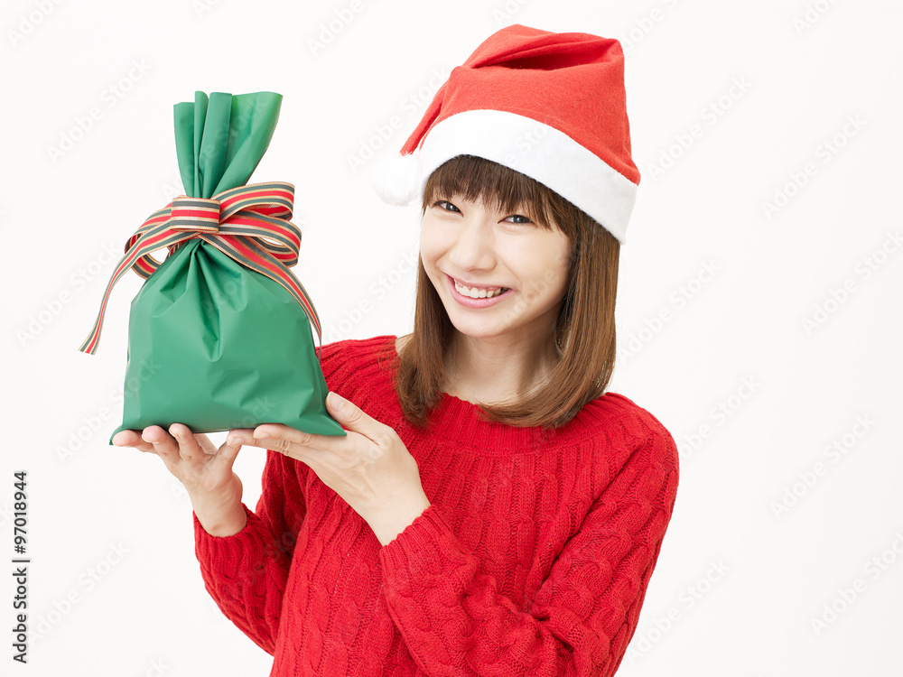 サンタ帽子をかぶる女性　クリスマスプレゼント