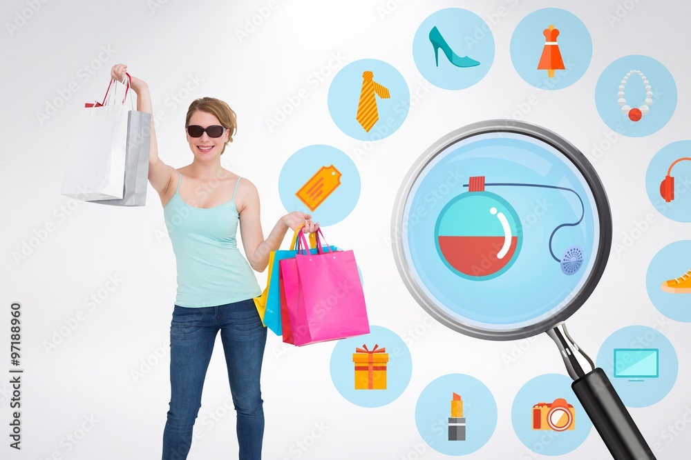 Smiling blonde woman standing with shopping bags