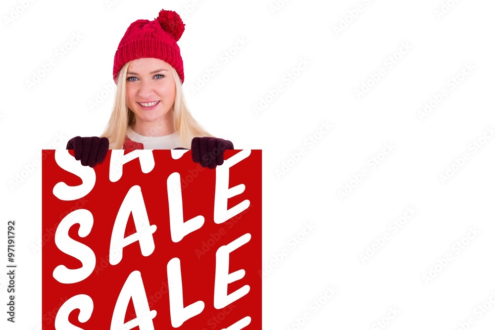 Composite image of festive blonde showing a red poster