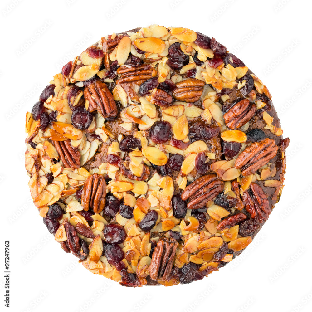 Pecan cake made with sliced almonds and dried cranberries isolated on white