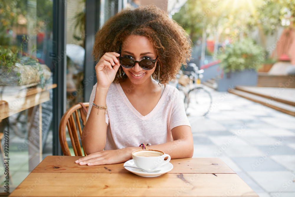 Pretty young girl at outdoor cafe