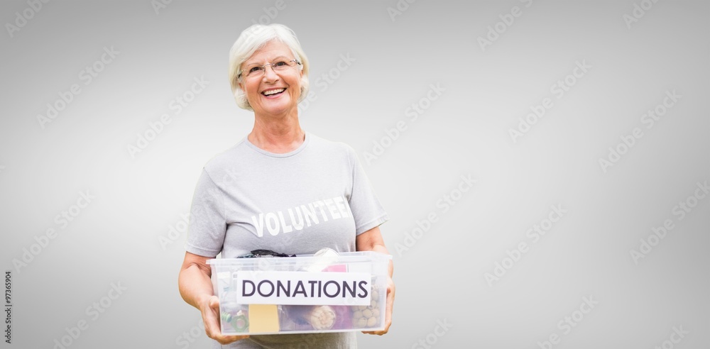 Composite image of happy grandmother holding donation box