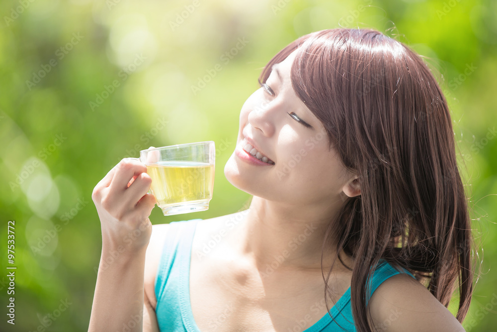 Young Woman drinking green tea