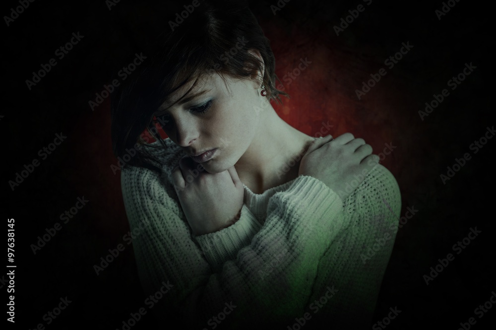 Composite image of sad brunette thinking with arms crossed