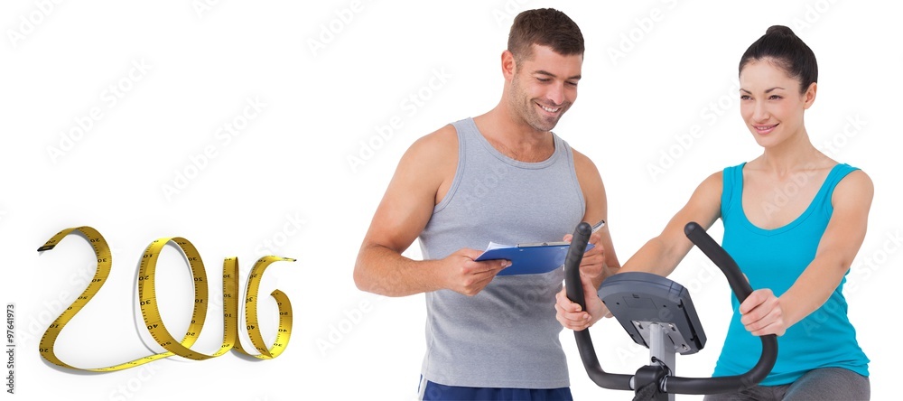 Composite image of trainer with client on exercise bike