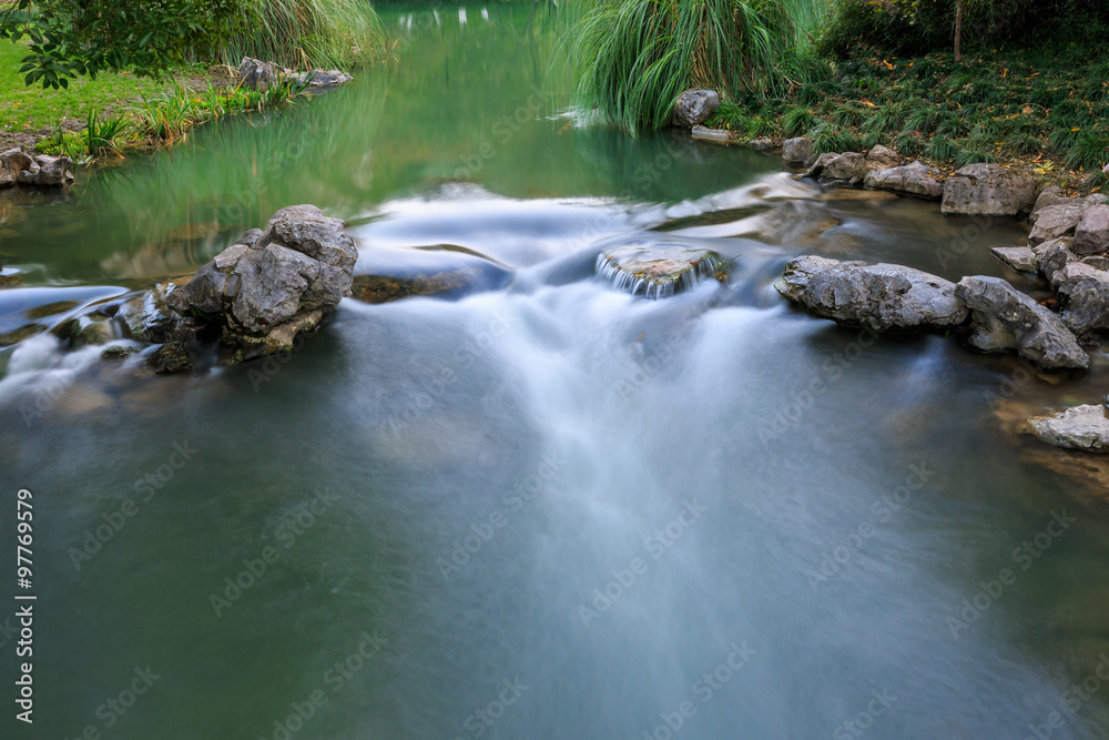 The stream flowing water in the autumn