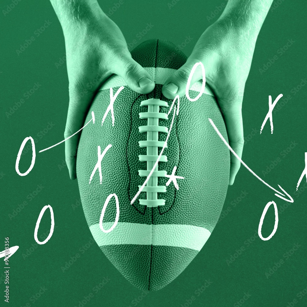 Composite image of american football player holding up football