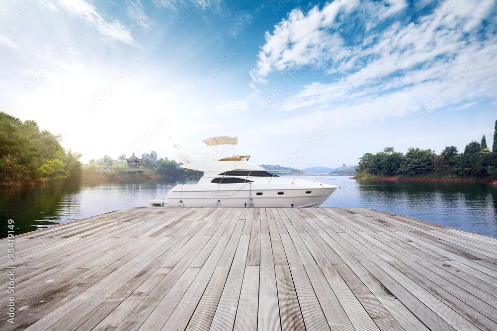 skyline wooden floor and yacht on lake