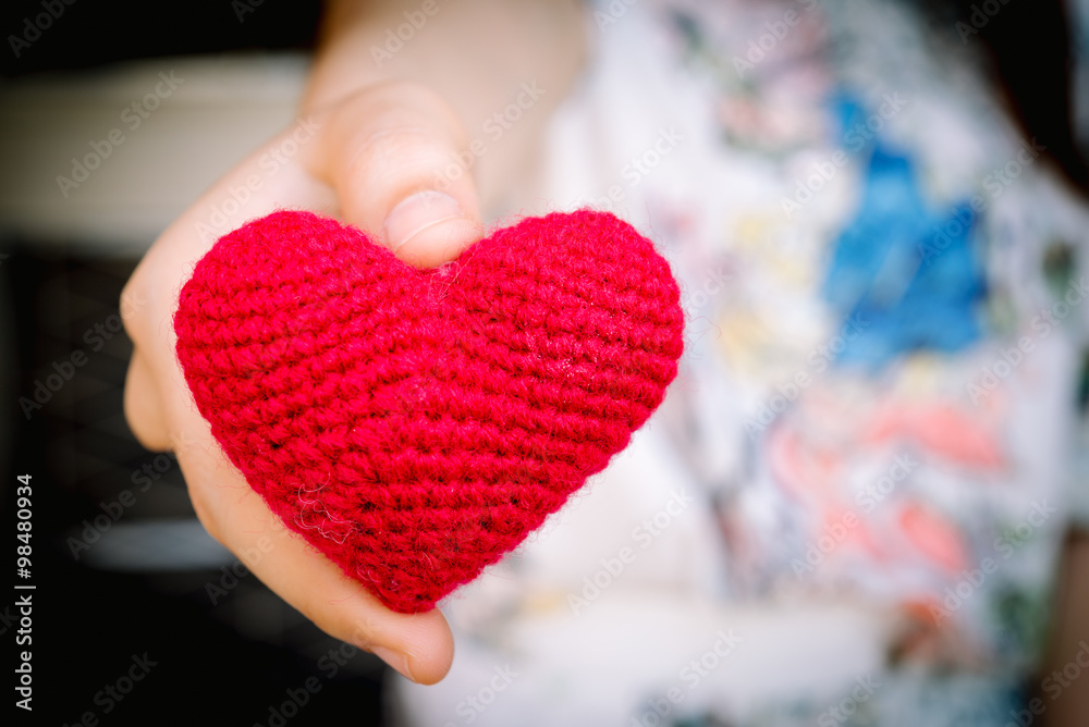 Female hands giving red heart, valentines day concept