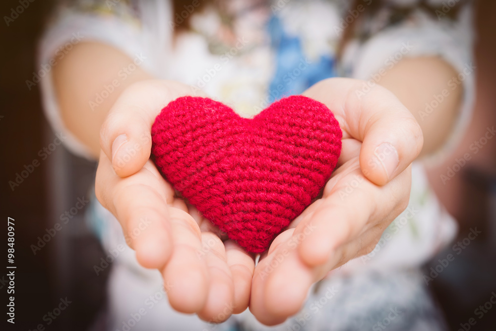 Female hands giving red heart, valentines day concept