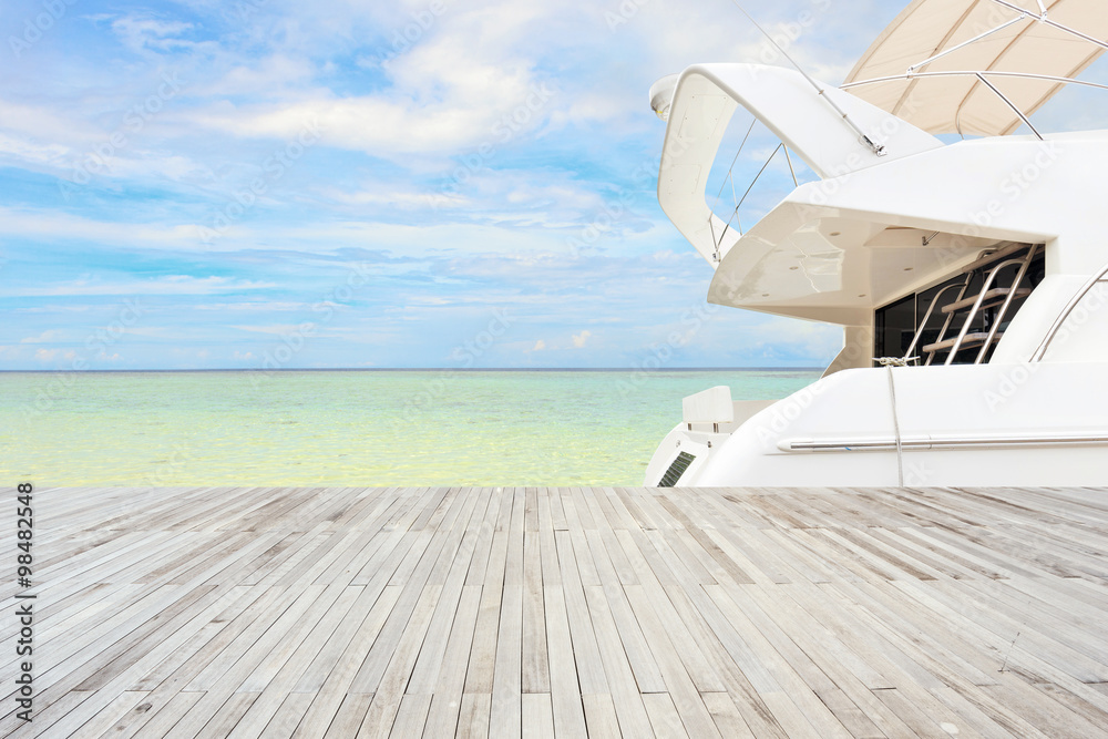 sunlight skyline and yacht along wooden floor