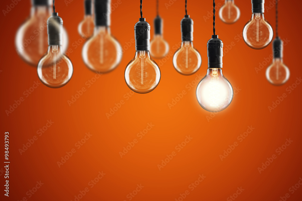 Idea and leadership concept Vintage incandescent Edison bulbs on