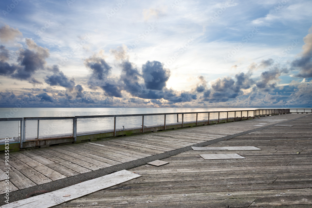 landscape of skyline and water from old wooden floor