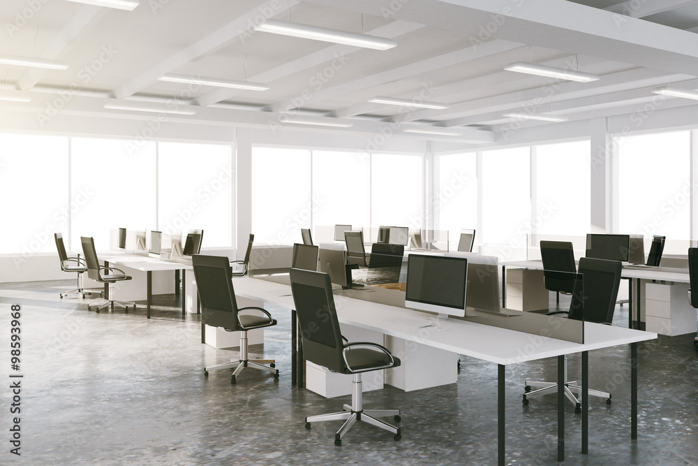 Open space loft office with furniture and big windows