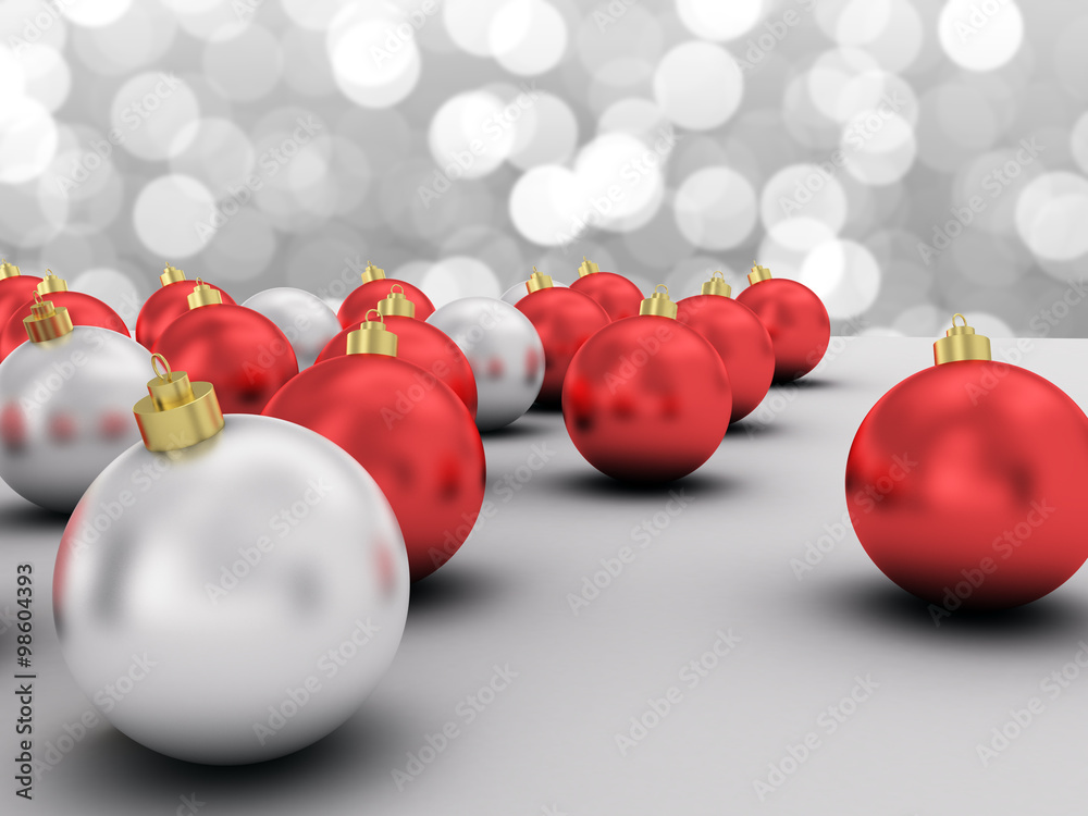 Red and silver Christmas balls with silver bokeh background.