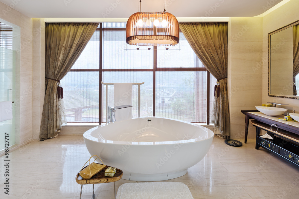 interior of modern bathroom with big bathtub