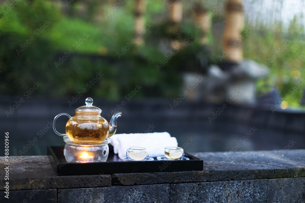 tea set on plate near spa pool