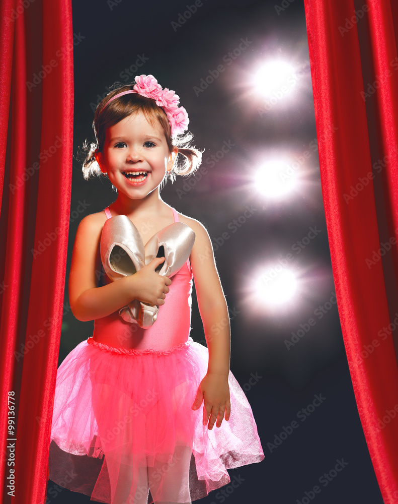 little girl ballerina ballet dancer on stage in red side scenes