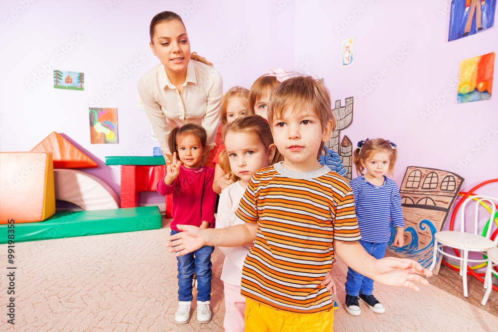 Portrait of kids group boys girls and nurse