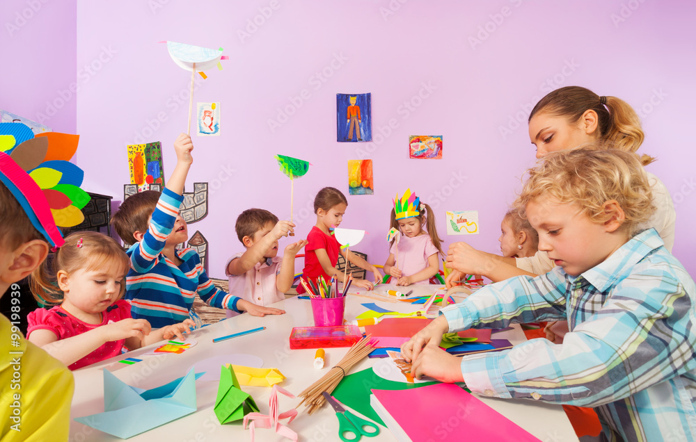 Creative preschool children with teacher