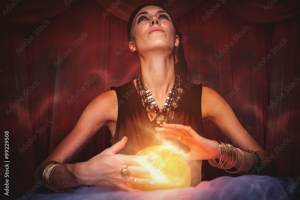 Composite image of fortune teller forecasting the future