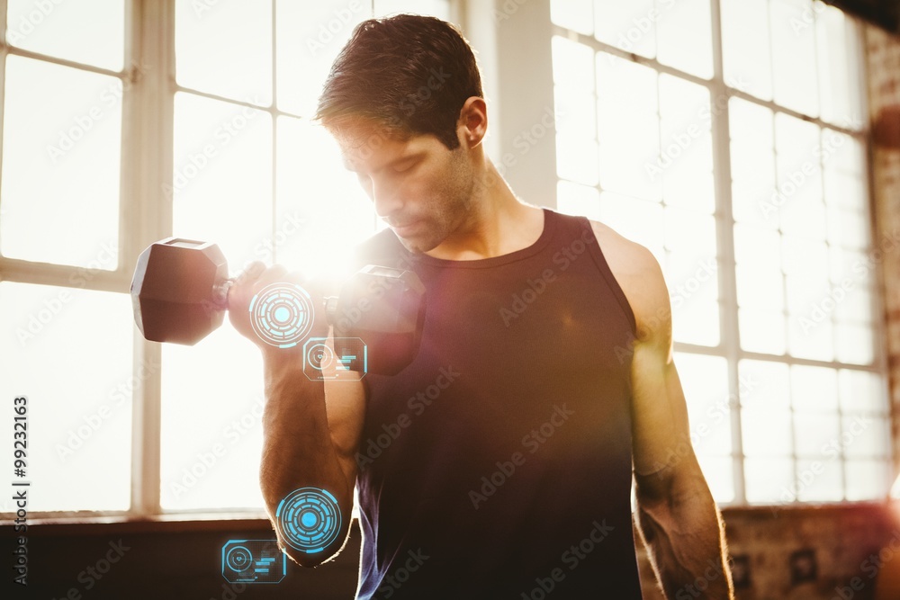 Composite image of handsome man lifting dumbbell