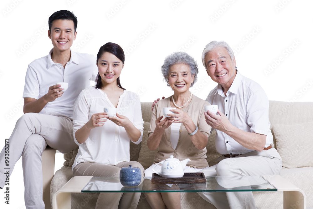 Cheerful family having tea