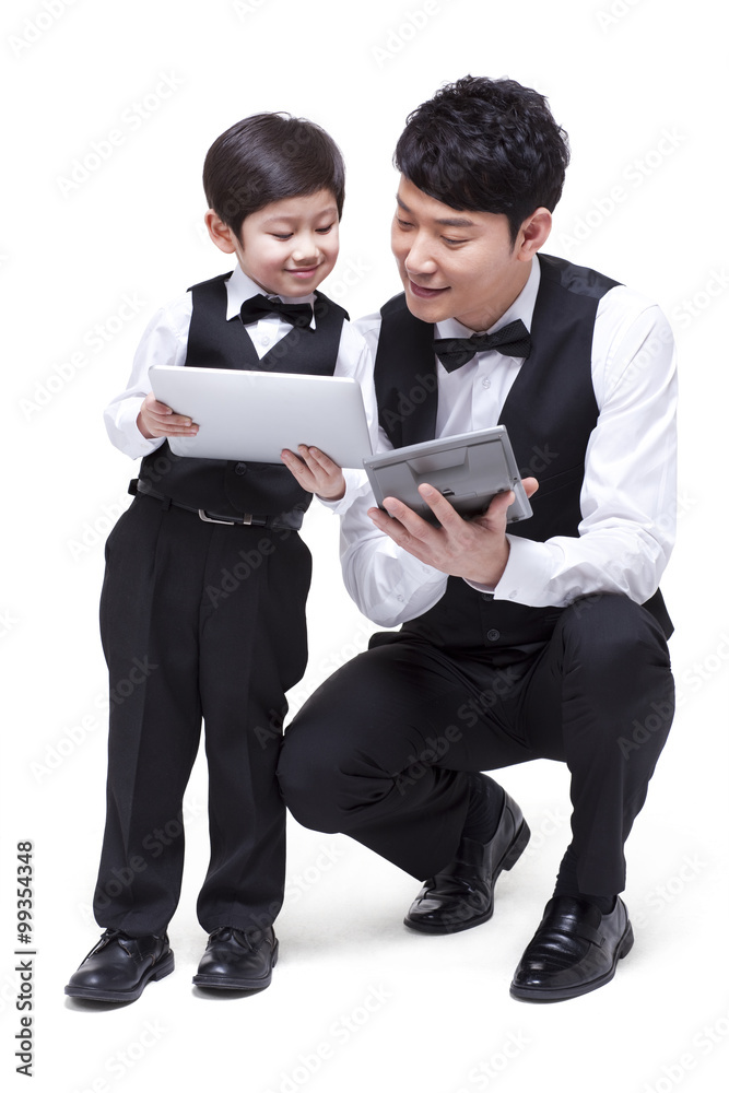 Young family with calculator and digital tablet