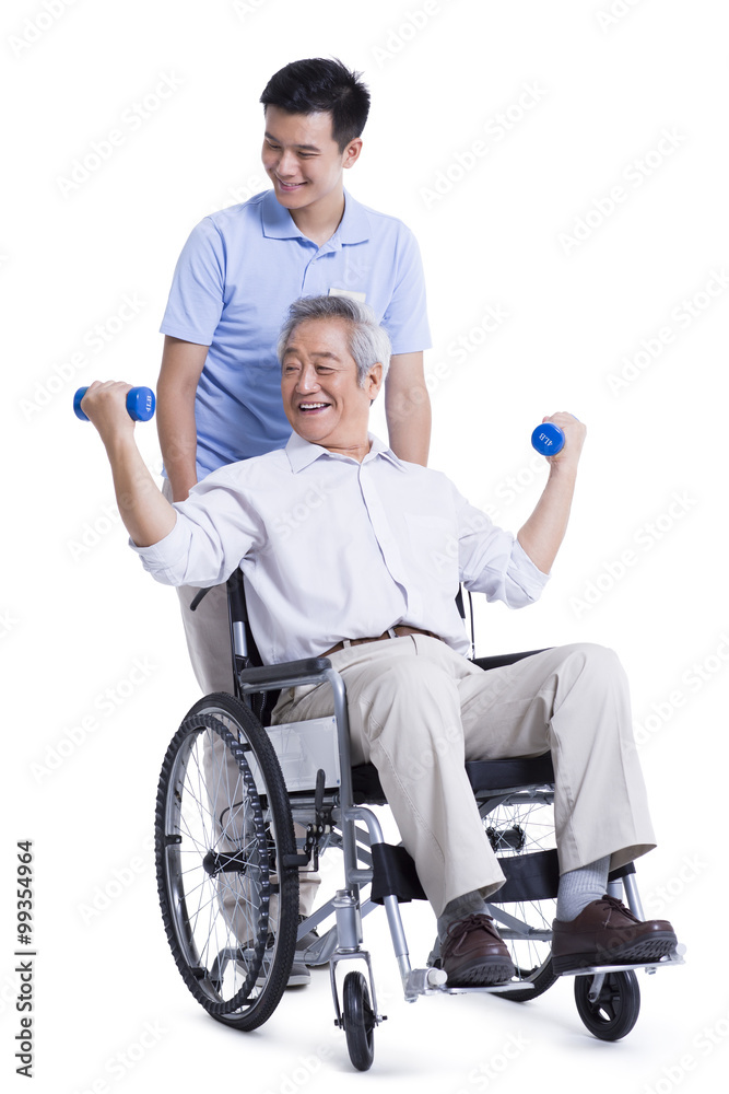 Male nursing worker helping senior man doing exercise