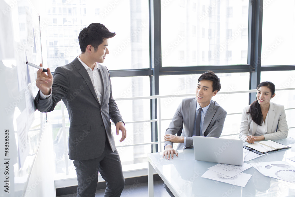 Young business person talking in meeting