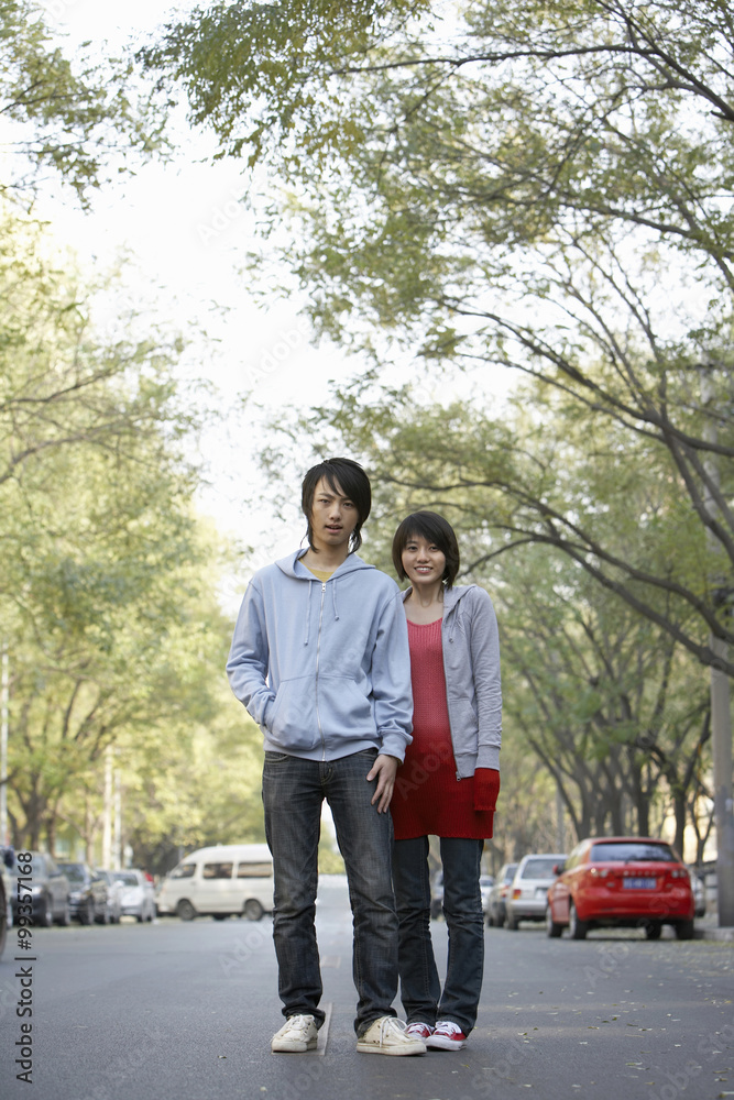 Young Couple Waiting At A Bus Station