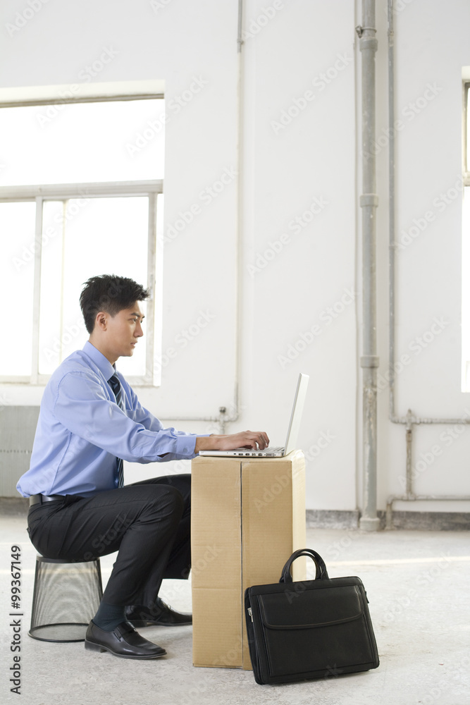 Businessman working in an empty office space