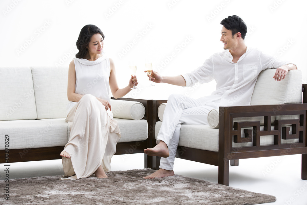 Cheerful young couple with champagne