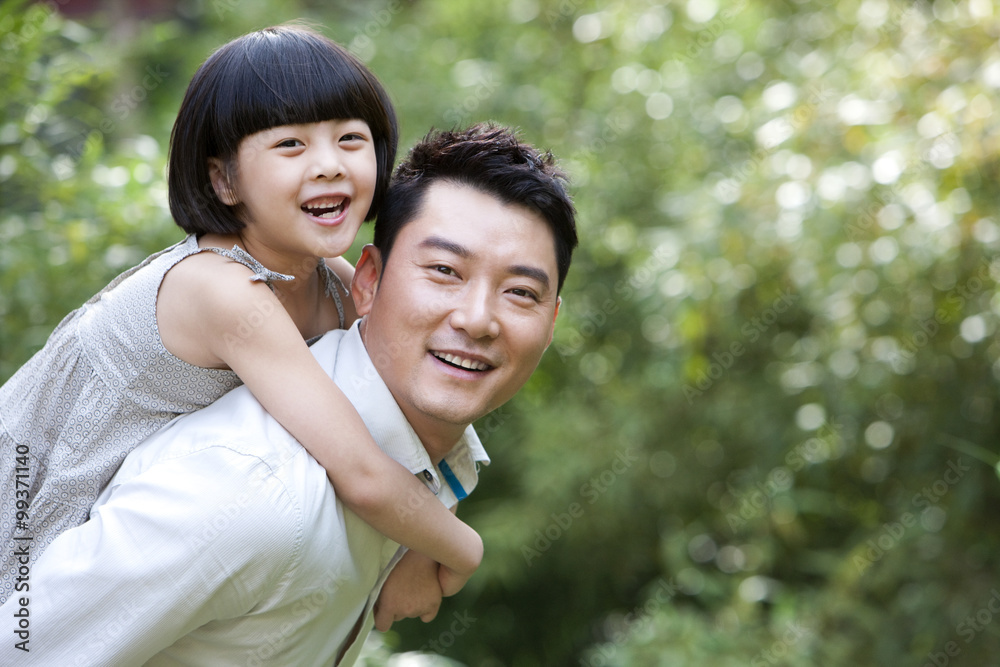 Father and daughter having fun in garden