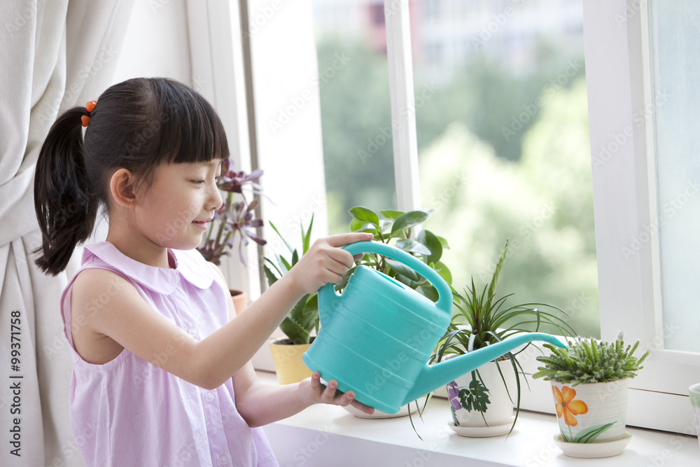 Girl watering the potted palnts