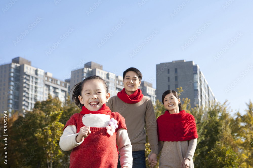 Young Family Enjoying a Park in Autumn