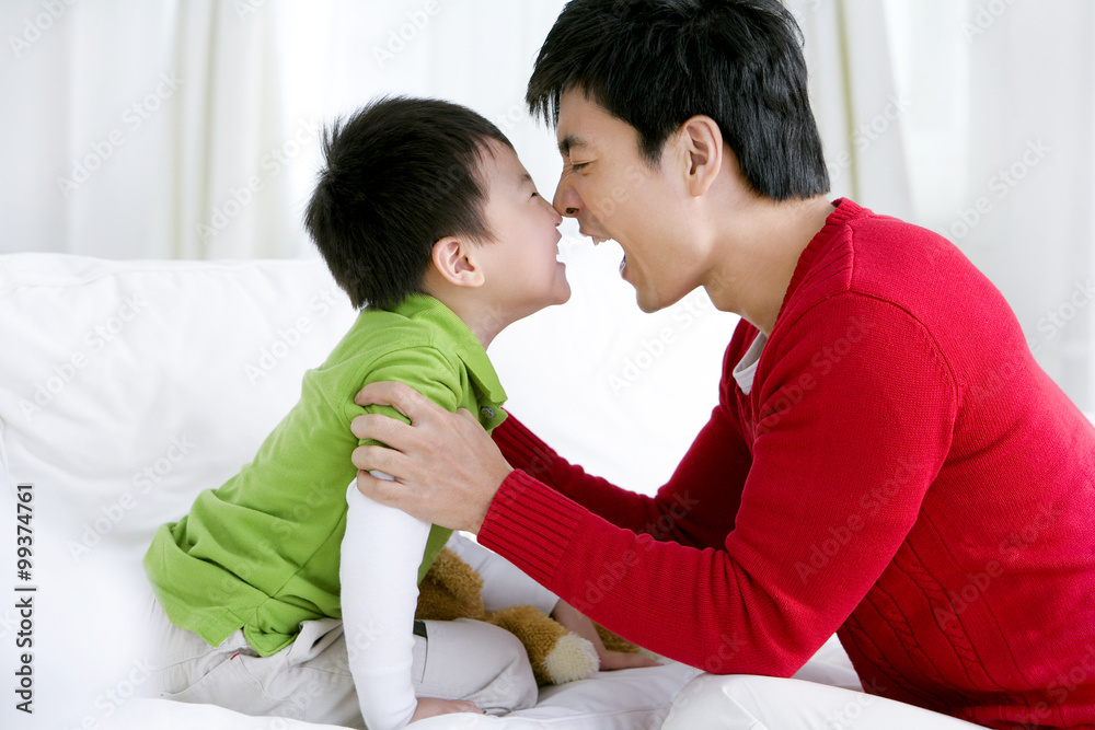 Happy Chinese father with son