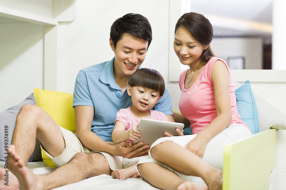 Happy family with digital tablet