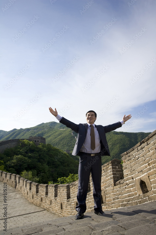 Happy businessman on the Great Wall