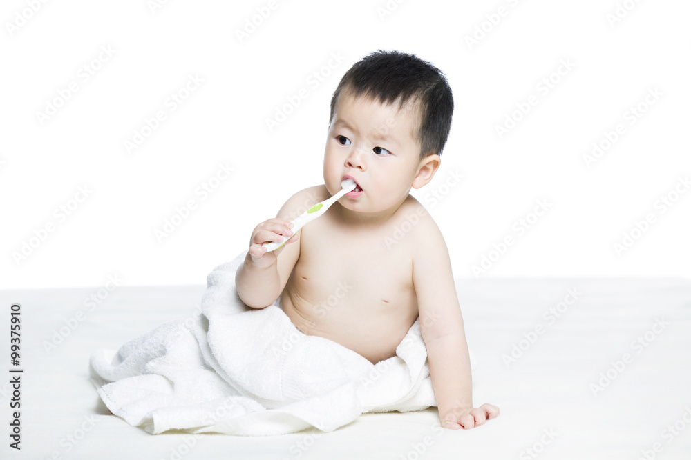 Cute baby brushing teeth