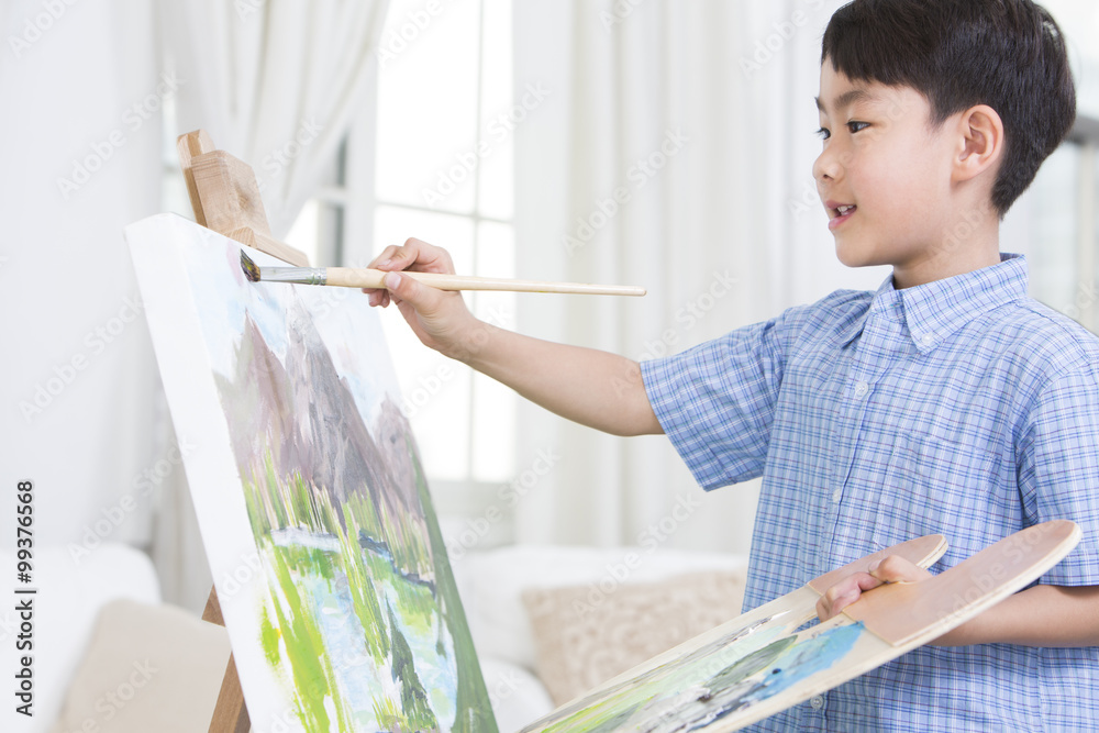 Little boy painting