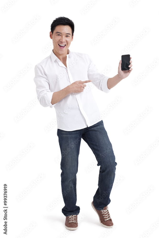 Young man showing mobile phone